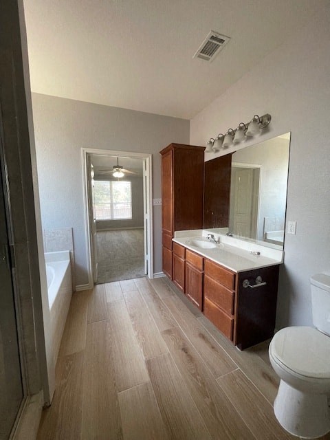 a bathroom with a toilet sink and a mirror