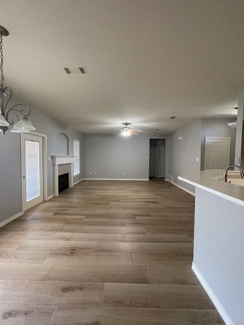 a large empty living room with a wood floor