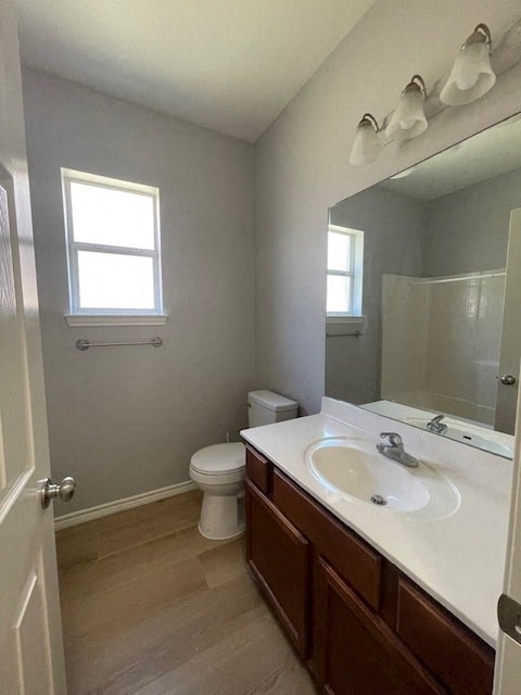 a bathroom with a sink and a toilet and a mirror