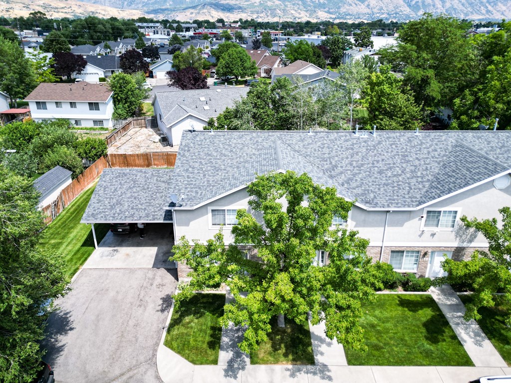 A residential area with houses and greenery.