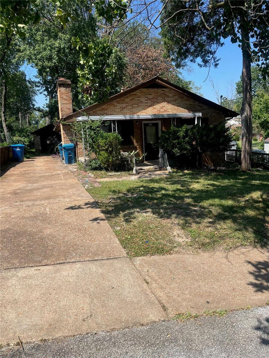 a house with a sidewalk in front of it