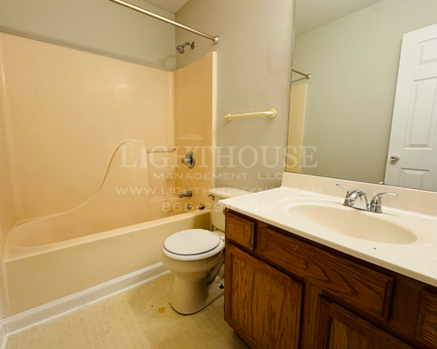 a bathroom with a toilet and a sink