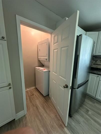 a small kitchen with a refrigerator and a washing machine