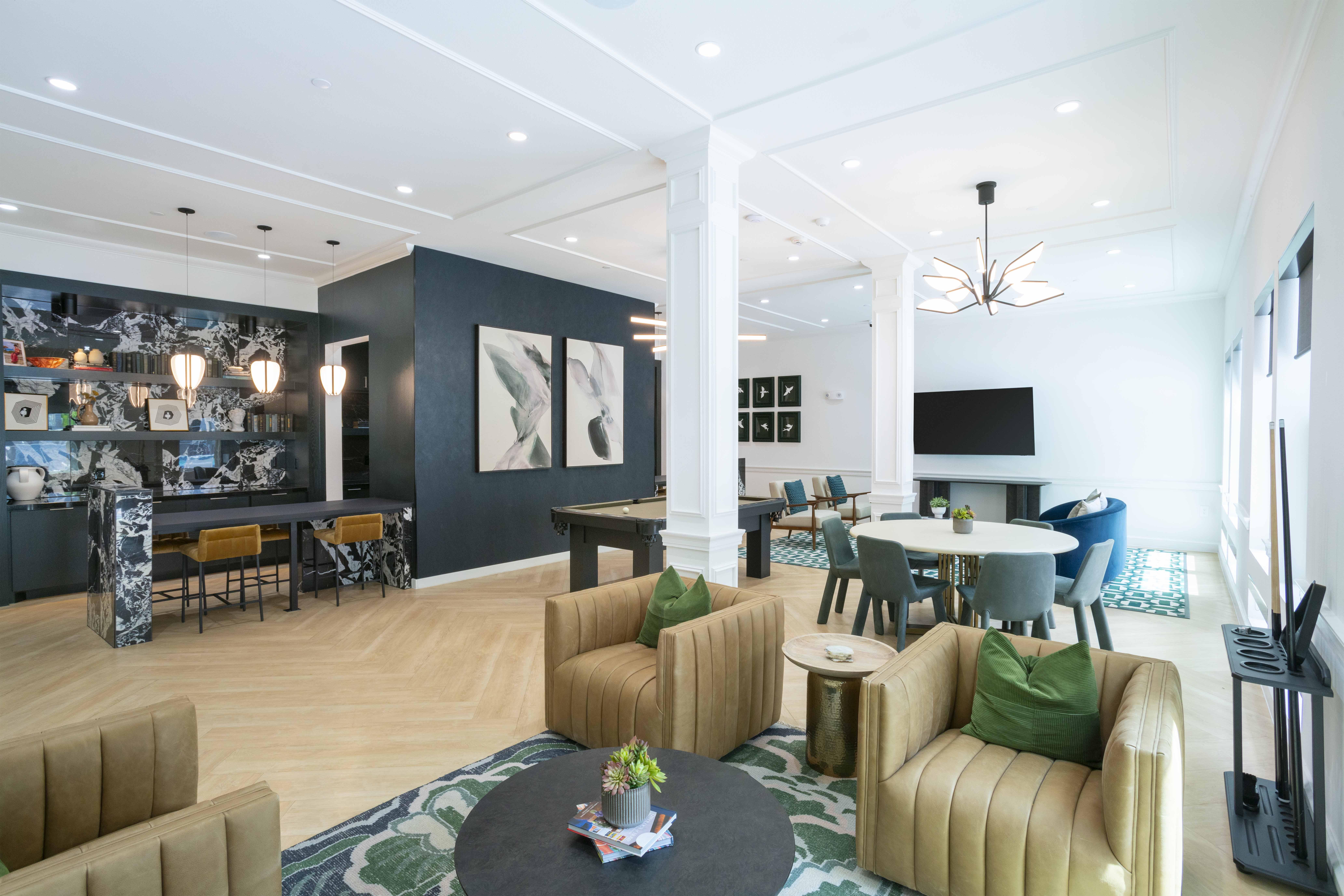 A modern living room with a mix of furniture and decor.