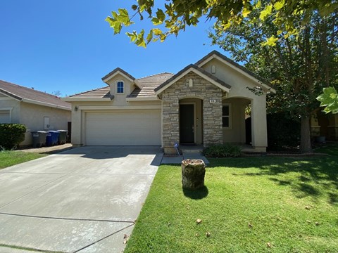 A house with a garage and a driveway.