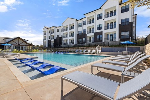 our apartments have a large pool and lounge chairs