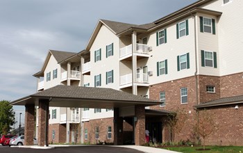 Exterior of Heritage Place, tall white and brick building - Photo Gallery 3