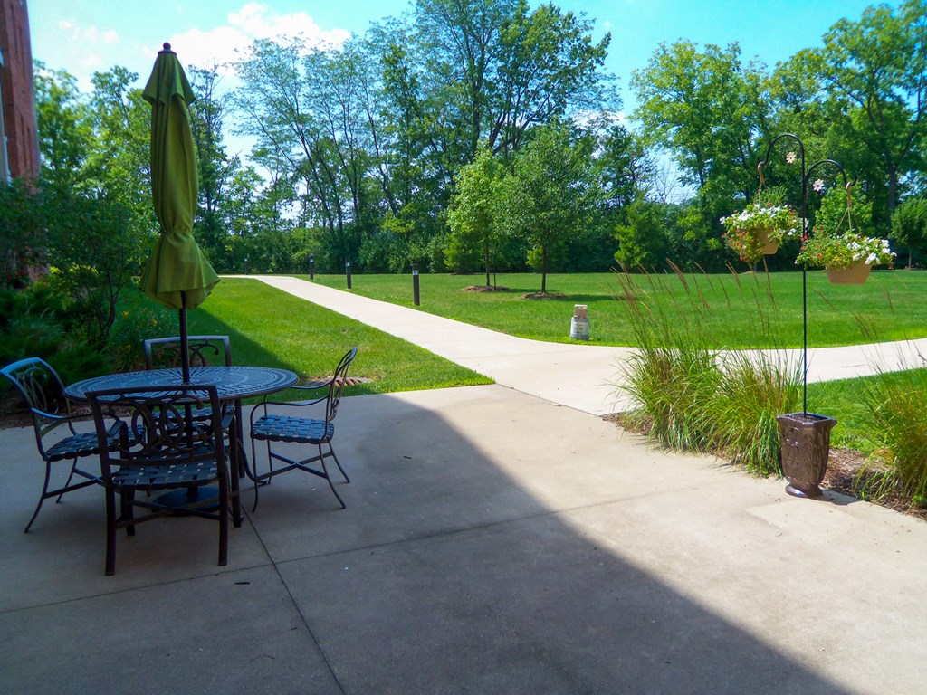 Large open grass area with seating