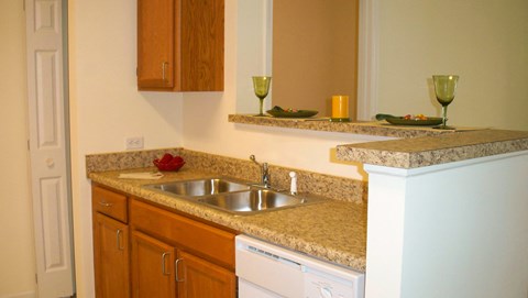 a kitchen with granite counter tops and a sink