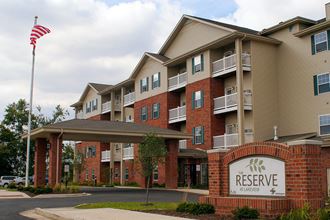 Exterior of The Reserve at Lakeview, large brick building