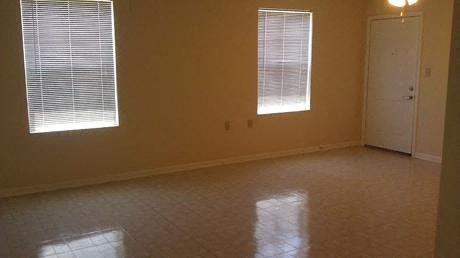 Bedroom, two windows, tile flooring and ceiling light