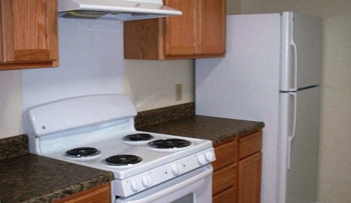Kitchen, wooden cabinets, white appliances