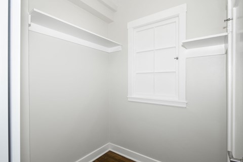 A white door is in the middle of a room.