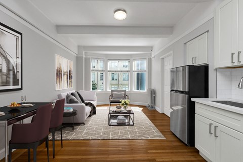 A modern kitchen with a dining table and chairs.