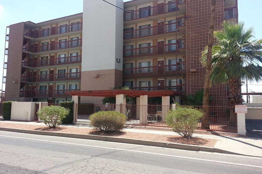 an apartment building on the side of a street