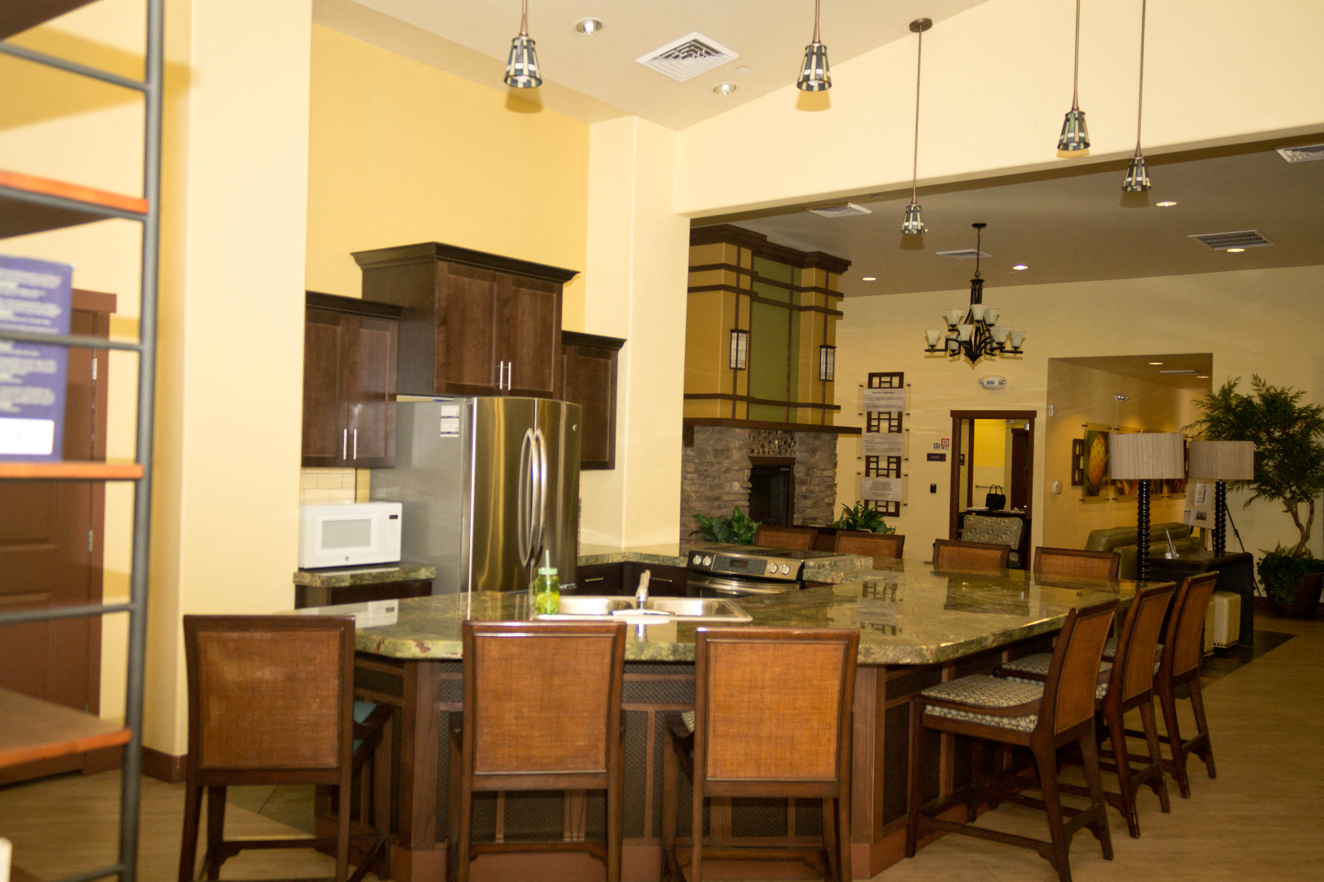 a large kitchen with a center island and a dining table