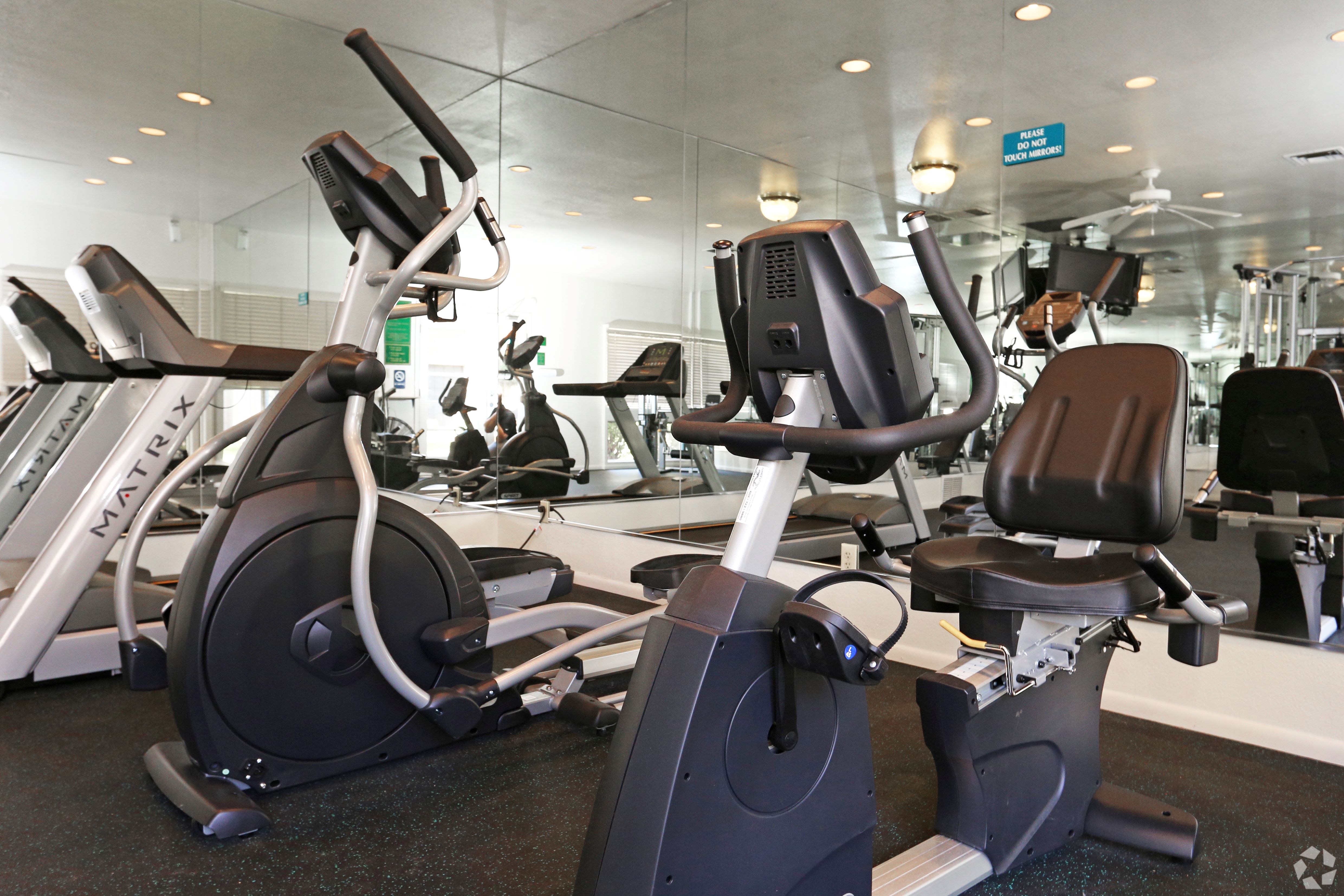 A gym with treadmills and exercise bikes.