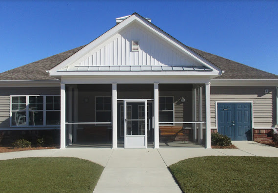 a house with a sidewalk in front of it