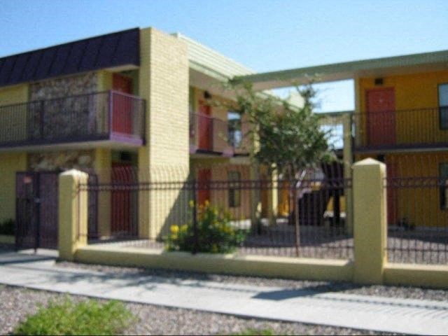 a building with a fence in front of it