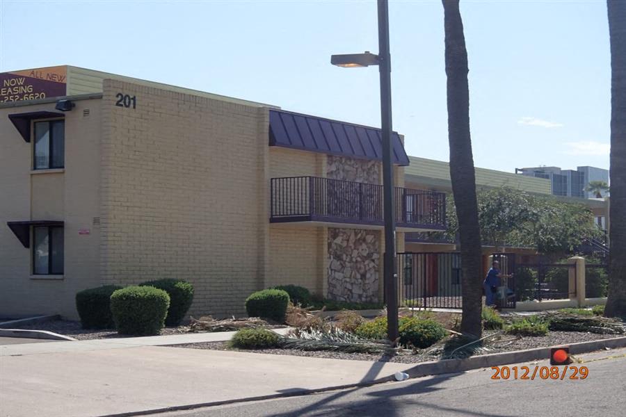 a building with a balcony and a street light