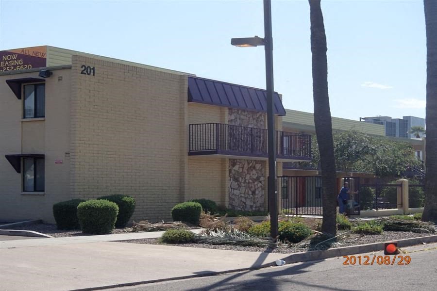 a building with a balcony and a street light