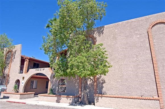 a building with a tree in front of it