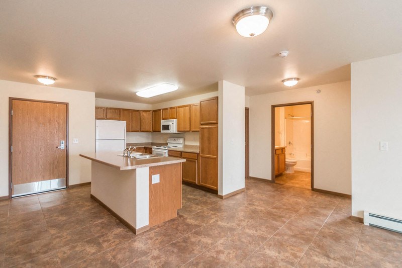 a kitchen with a counter top and a refrigerator