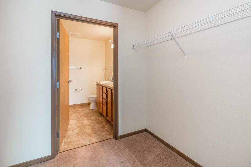 a bathroom with a sliding glass door and a toilet