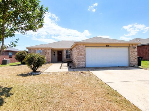 a house with a white garage door and a driveway