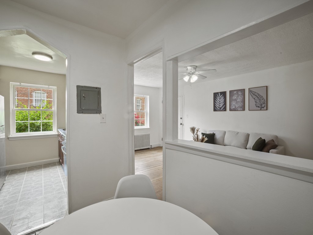A white room with a table and chairs.