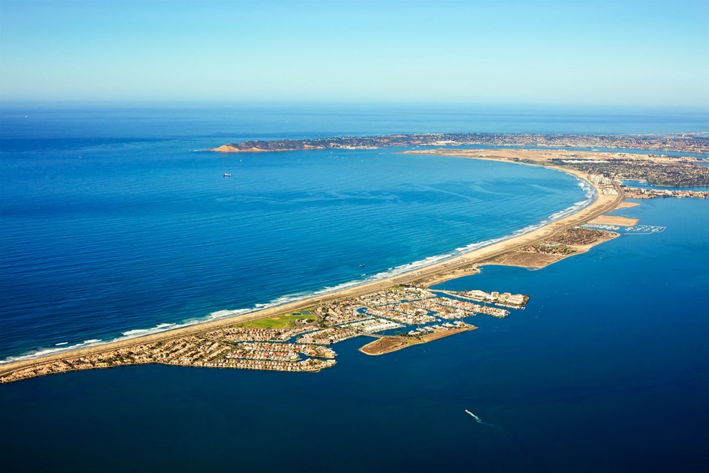 an aerial view of the beach and the ocean