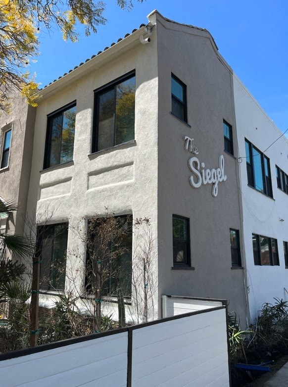 a white building with a sign on the side of it