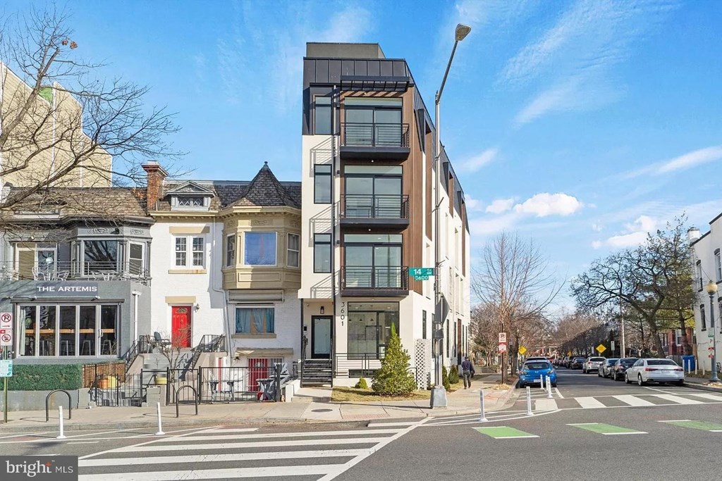 A street view with a building named "The Artemis" on the corner.