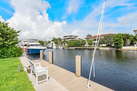 a dock with boats on the water at a marina