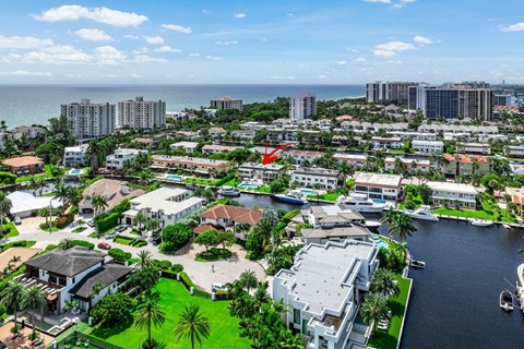 a view of the city with the ocean in the background