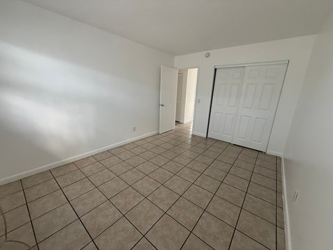 A room with white walls and a tiled floor.