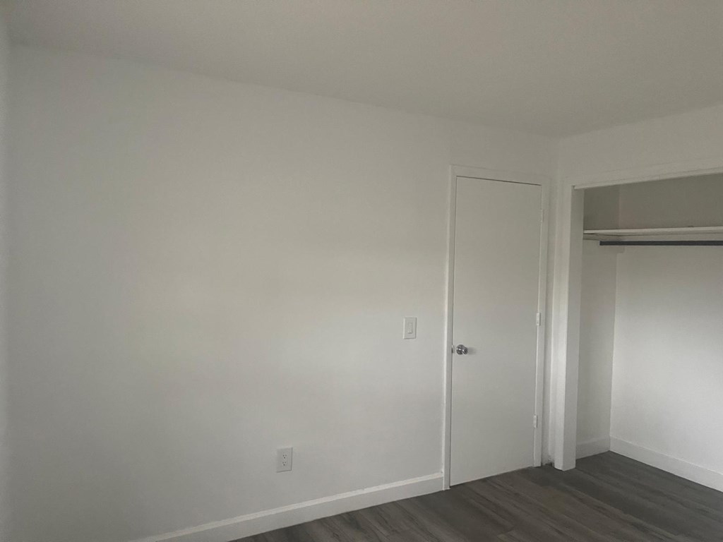 A room with a door and a window.