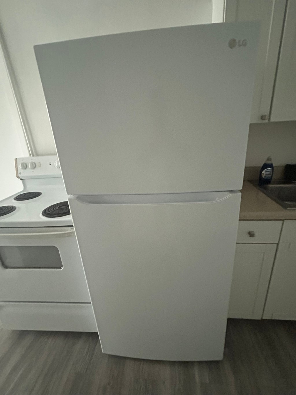 A white LG fridge in a kitchen.