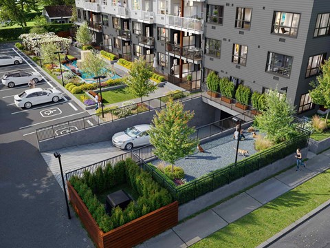 A modern apartment complex with a courtyard and a pool.