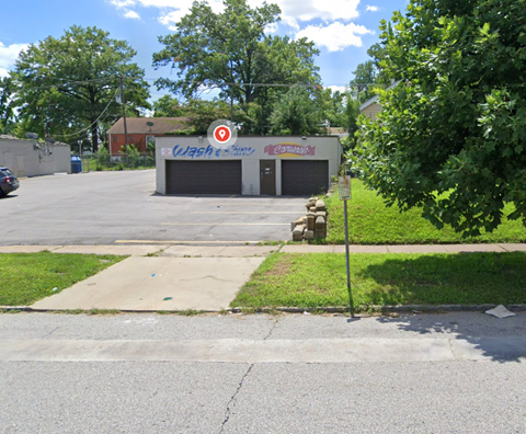 a parking lot in front of a car dealership