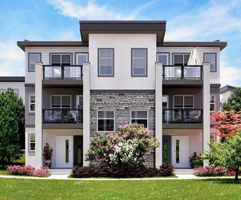 A modern two-story apartment building with a balcony on each floor.