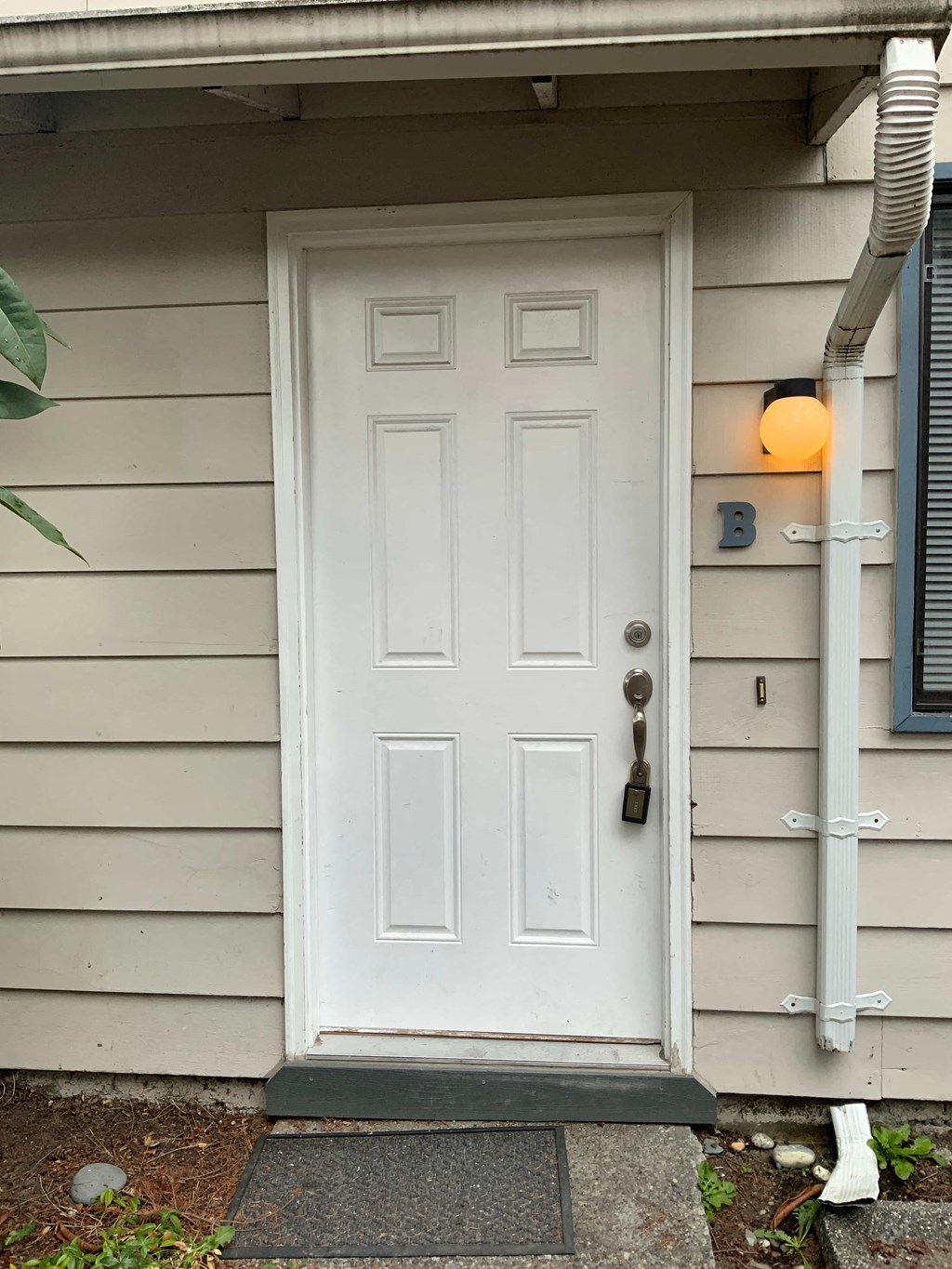 a white door on the side of a house