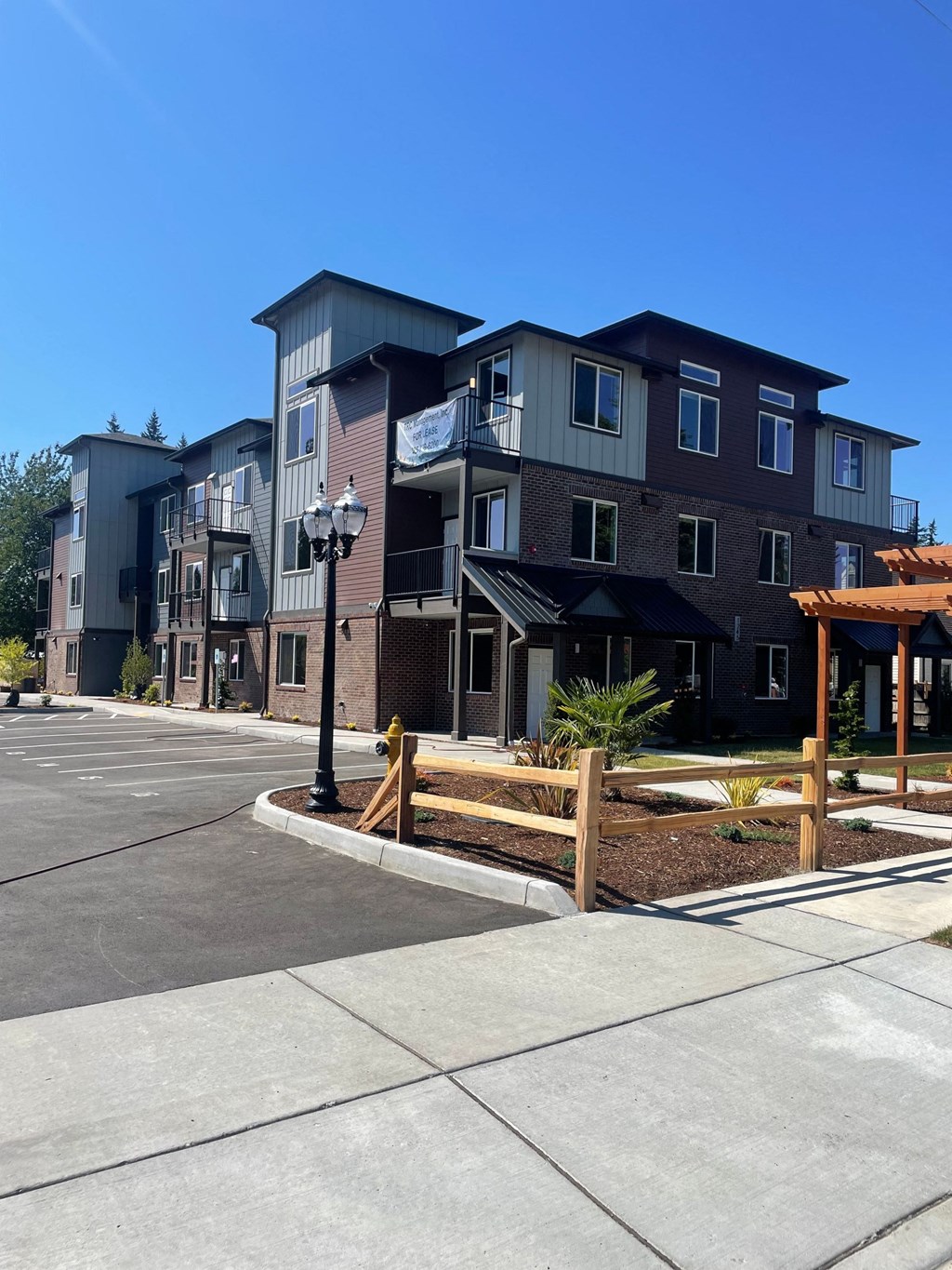 new apartment buildings on the side of a street