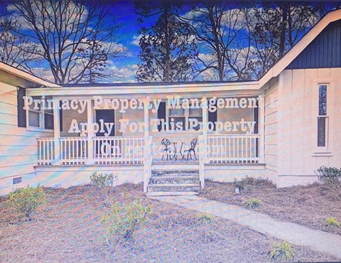 a sign on the side of a building that says putray property mangement apply