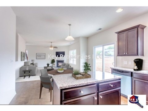 A kitchen with brown cabinets and a white countertop.
