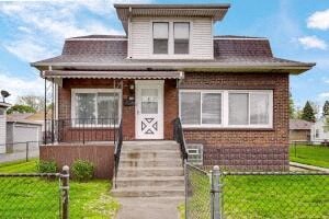 the front of a brick house with a fence