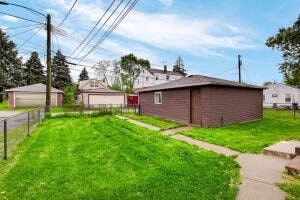 a house with a yard and a sidewalk