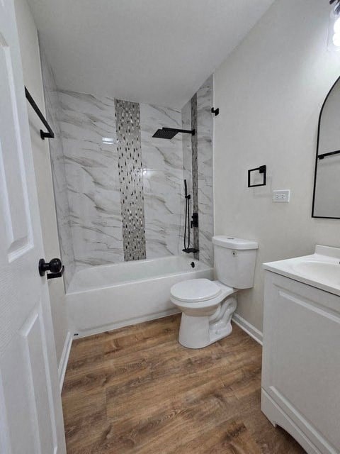 a bathroom with a toilet and a tub and a sink