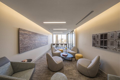 a living room with couches and chairs and a table