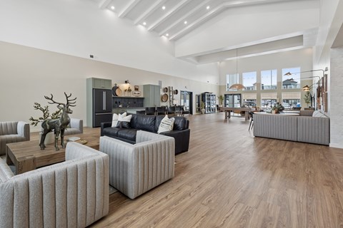 a living room with couches and chairs and a table